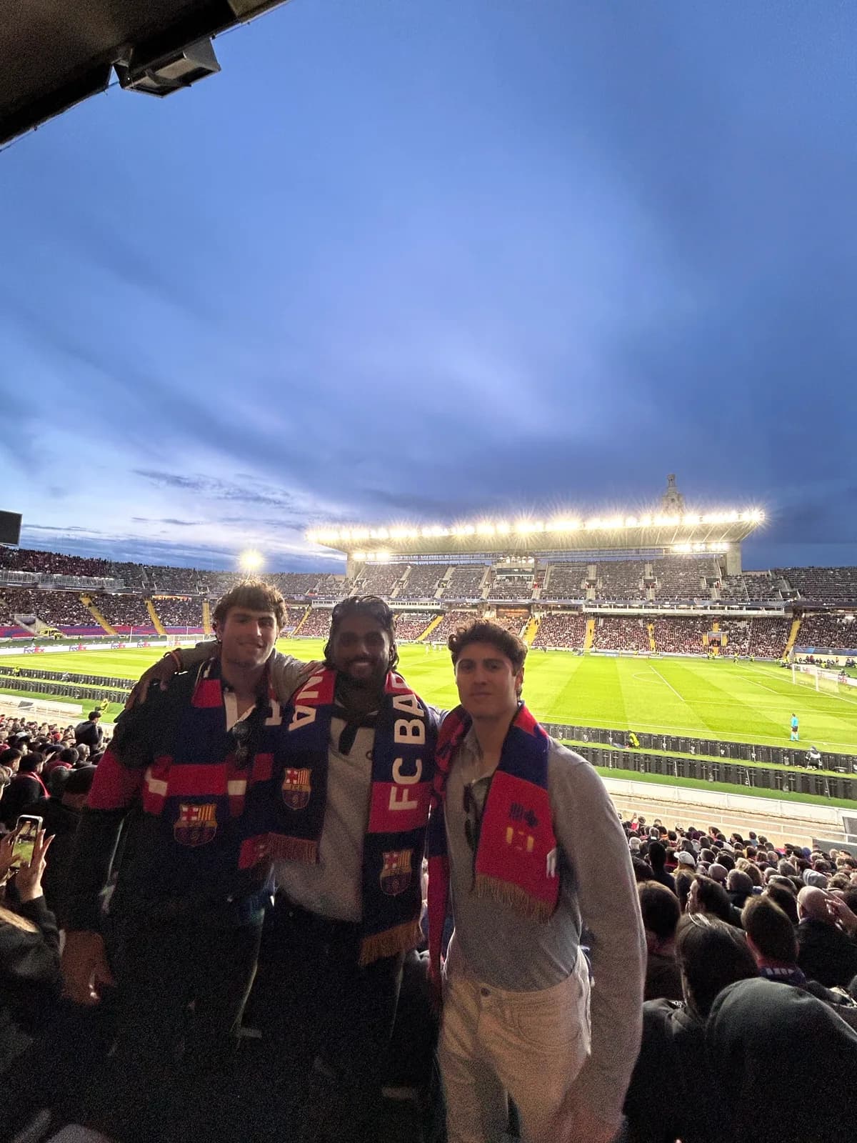 Efe Dincaslan at an FC Barcelona match in Spain wearing the club scarf