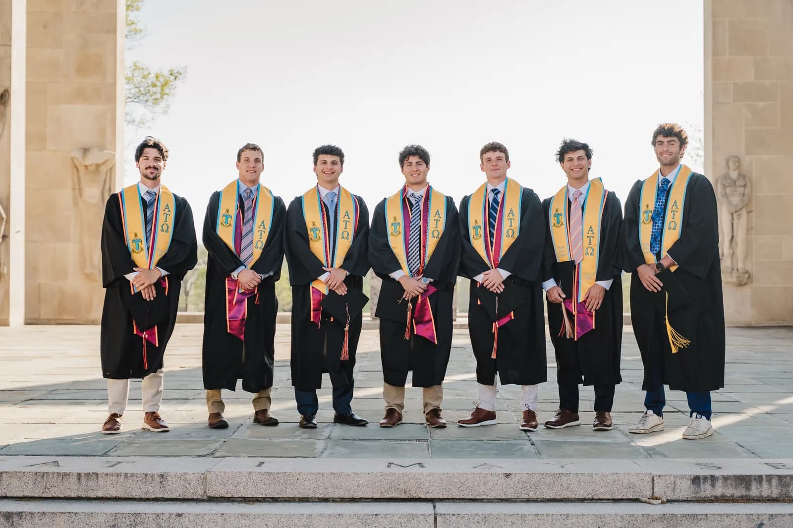 Efe Dincaslan with classmates in cap and gown at Virginia Tech graduation